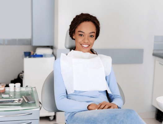 Woman in dental chair smiling