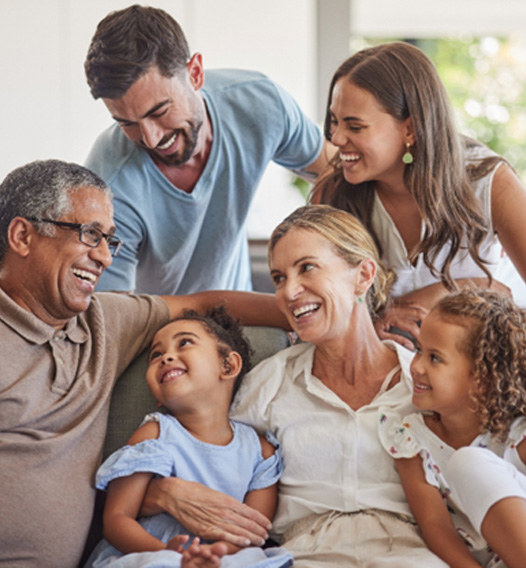 a family sitting on a couch together