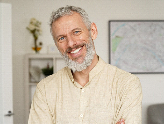 Man smiling with dental bridge in DuPont