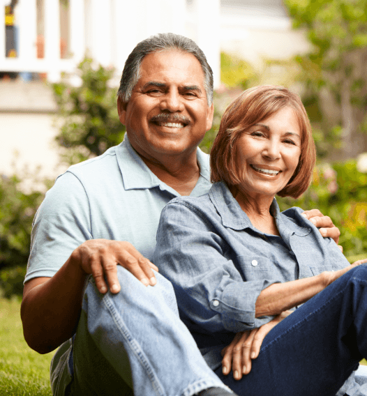 Man and woman smiling after dental appointment