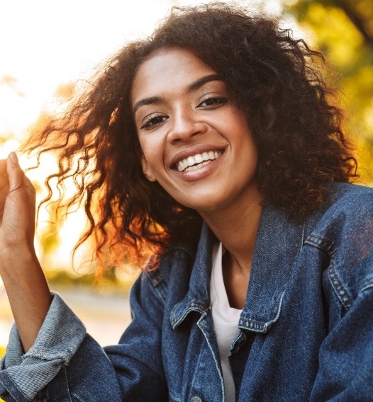 Woman sharing healthy smile after dental checkup and teeth cleaning visit