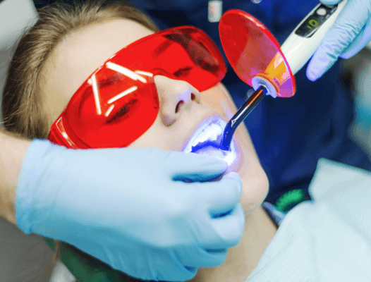 Patient receiving dental bonding treatment