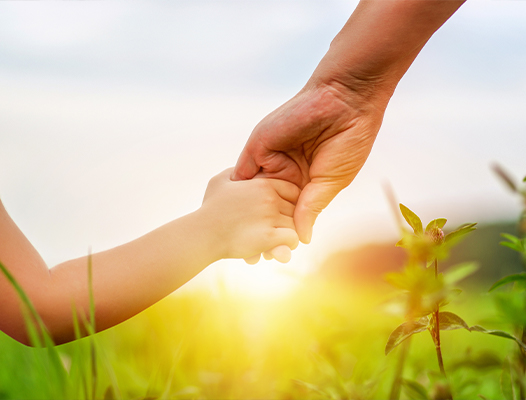 Person holding hand with a child