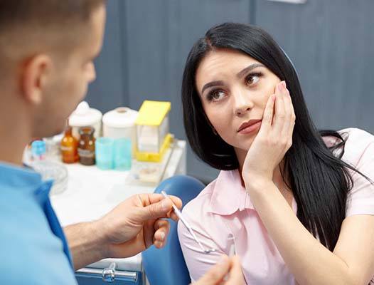 Patient with toothache visiting her DuPont emergency dentist