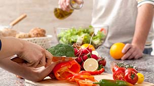 People preparing fresh food to prevent dental emergencies in DuPont