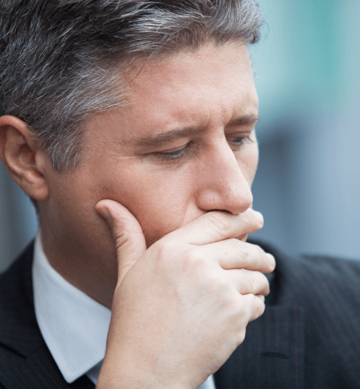 Man in need of tooth extraction covering his mouth