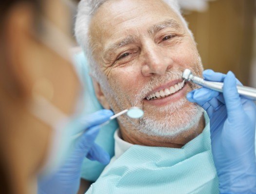 Older man receiving restorative dentistry