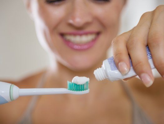 Patient using fluoride toothpaste