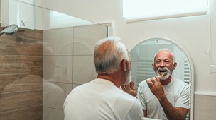 Man brushing teeth in DuPont