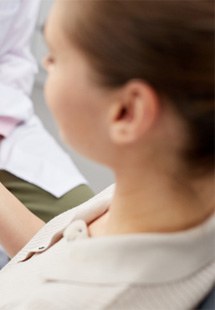 dentist explaining dental implant model near Nisqually