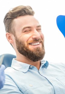 man smiling while visiting dentist near Nisqually