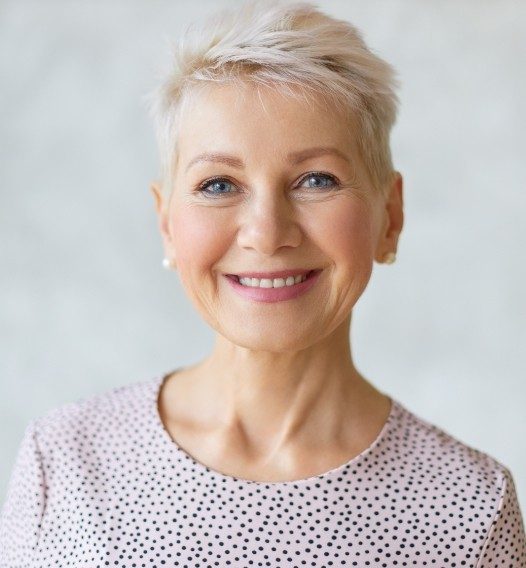 Woman with partial denture smiling