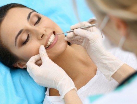 Woman receiving periodontal therapy
