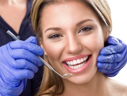 Woman receiving dental checkup