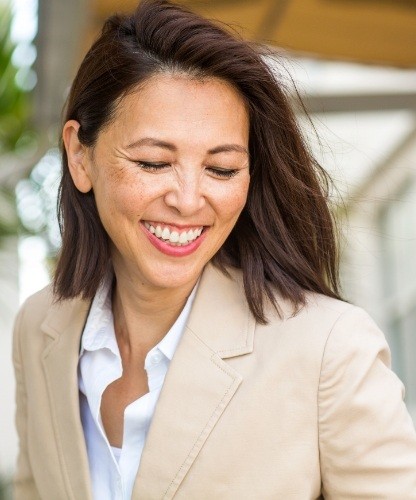 Woman laughing after sedation dentistry visit