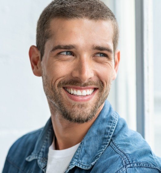 Man with healthy smile after tooth colored fillings