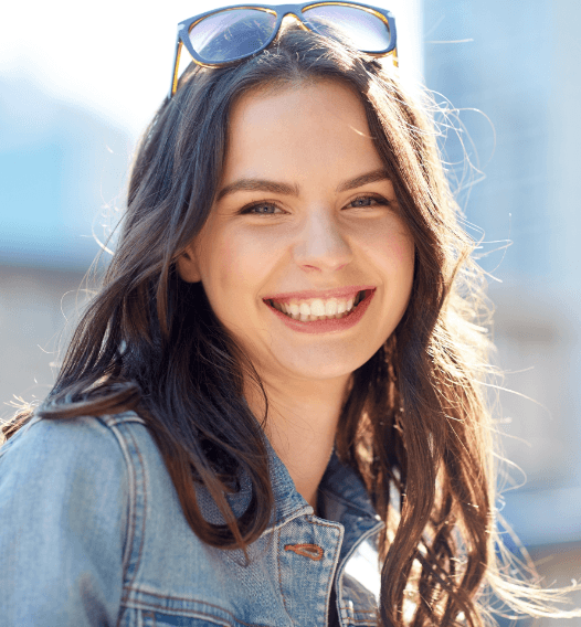 Woman smiling after wisdom tooth extraction