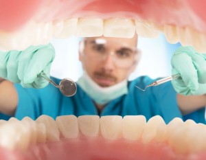40860294 - dentist checks the teeth of a patient