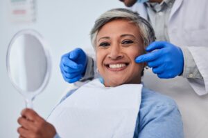 a smiling patient after receiving cosmetic dentistry